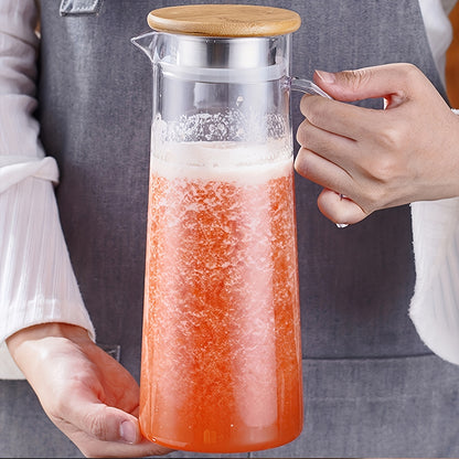 Large capacity ice bucket beverage pitcher made of durable and transparent polycarbonate with filter lid and easy pour spout for cold drinks, beer.