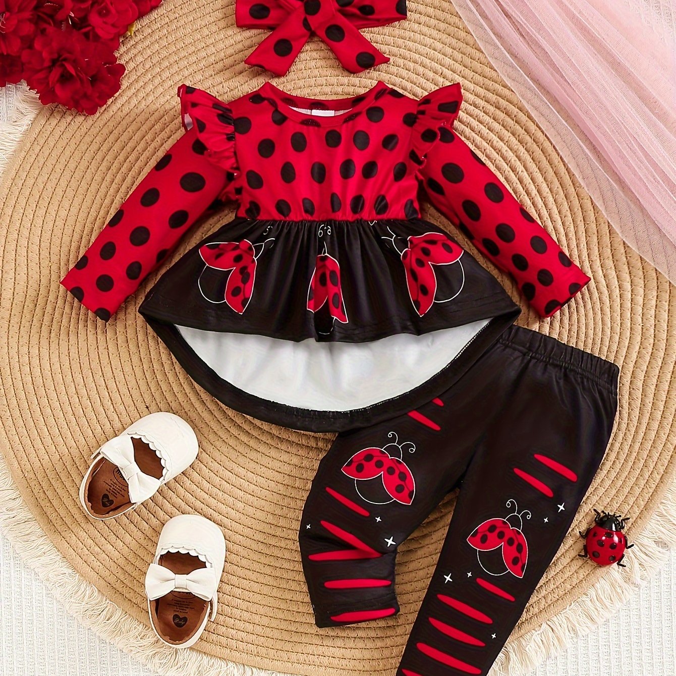 Ladybug print polyester toddler outfit with long sleeve crew neck pullover, matching pants, and headband. Made from slight stretch knit fabric for fall/winter. Regular fit raglan sleeve