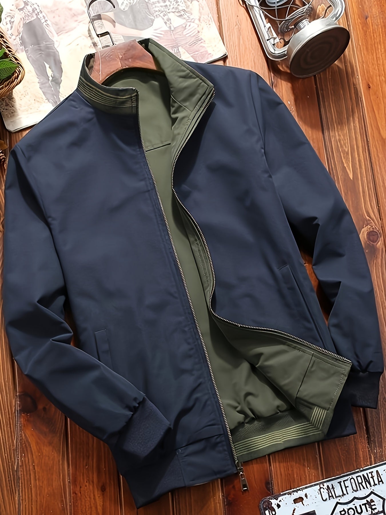 Men's olive green zip-up jacket with stand collar, dual-sided design and pockets. Machine washable and trendy for casual wear.