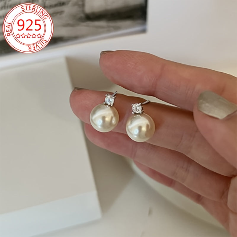 Add a touch of elegance with these stunning 925 Sterling Silver Stud Earrings featuring Sparkling Moissanite and Freshwater Imitation Pearl. This Hypoallergenic Luxury Vintage Style Jewelry is perfect for women, ideal for gifting and special occasions.