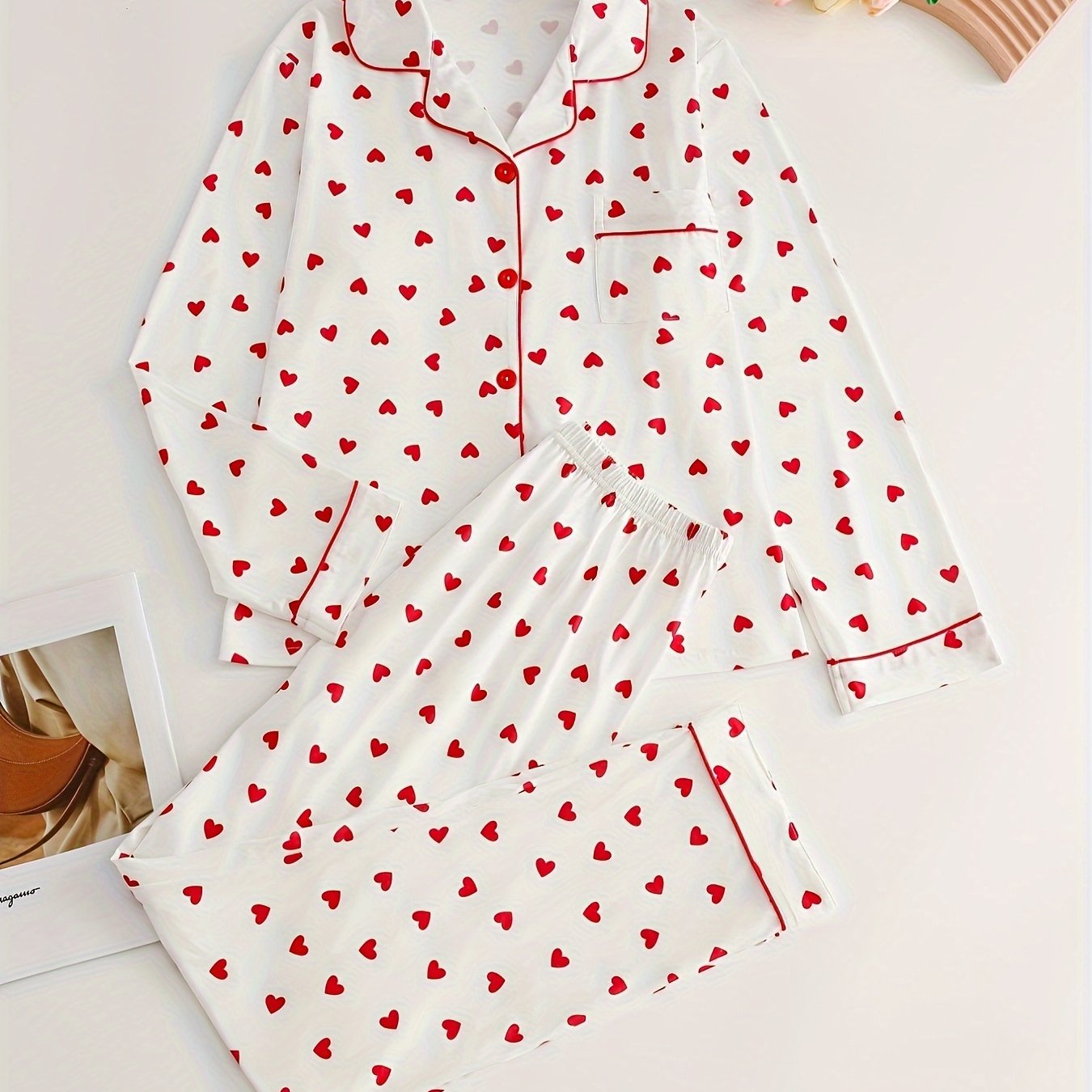 Elegant lady's pajama set for spring/autumn with long sleeve top and heart pattern, paired with cozy pants for home comfort.