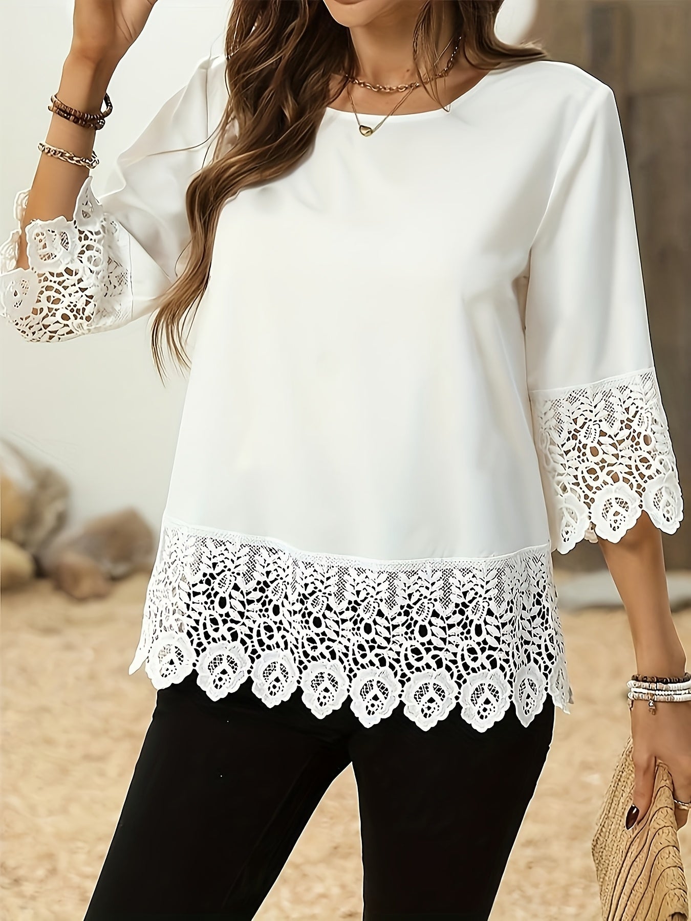 Elegant white plus size blouse for women made of polyester. Features round neck and half sleeves, ideal for spring and summer wear.