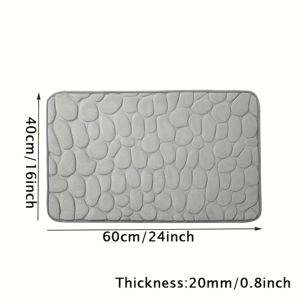 Upgrade your bathroom with the luxurious 1PC Pebble Embossed Memory Foam Bath Mat. This quick-drying carpet not only adds a touch of elegance to your living room but also provides a comfortable and washable non-slip surface for your bathroom. Elevate