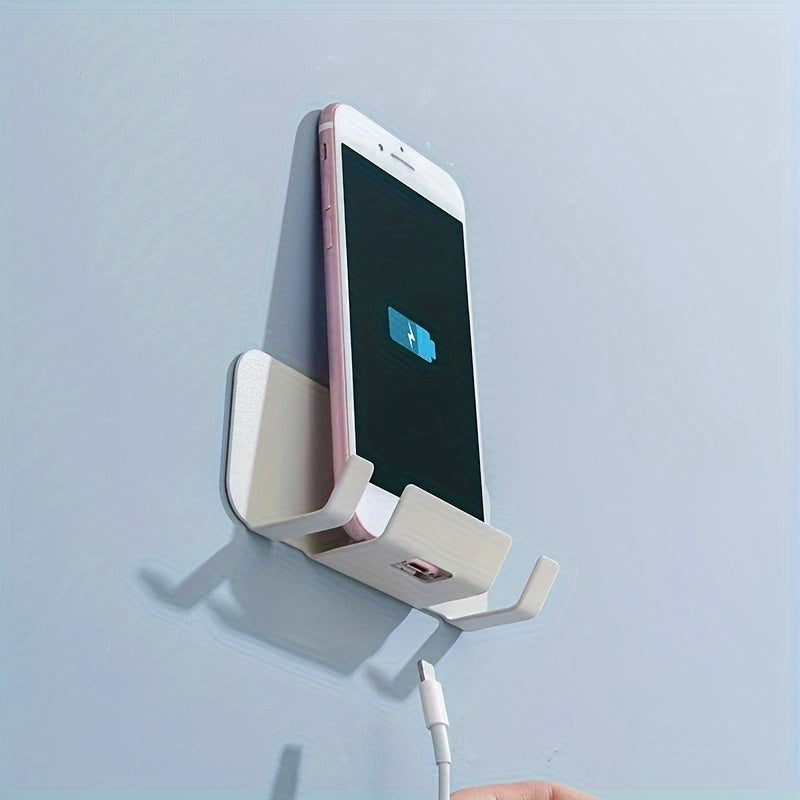 Wall-mounted mobile phone holder made of carbon steel, self-adhesive charging bracket with contemporary style. No punch installation, perfect for kitchen use and live streaming.