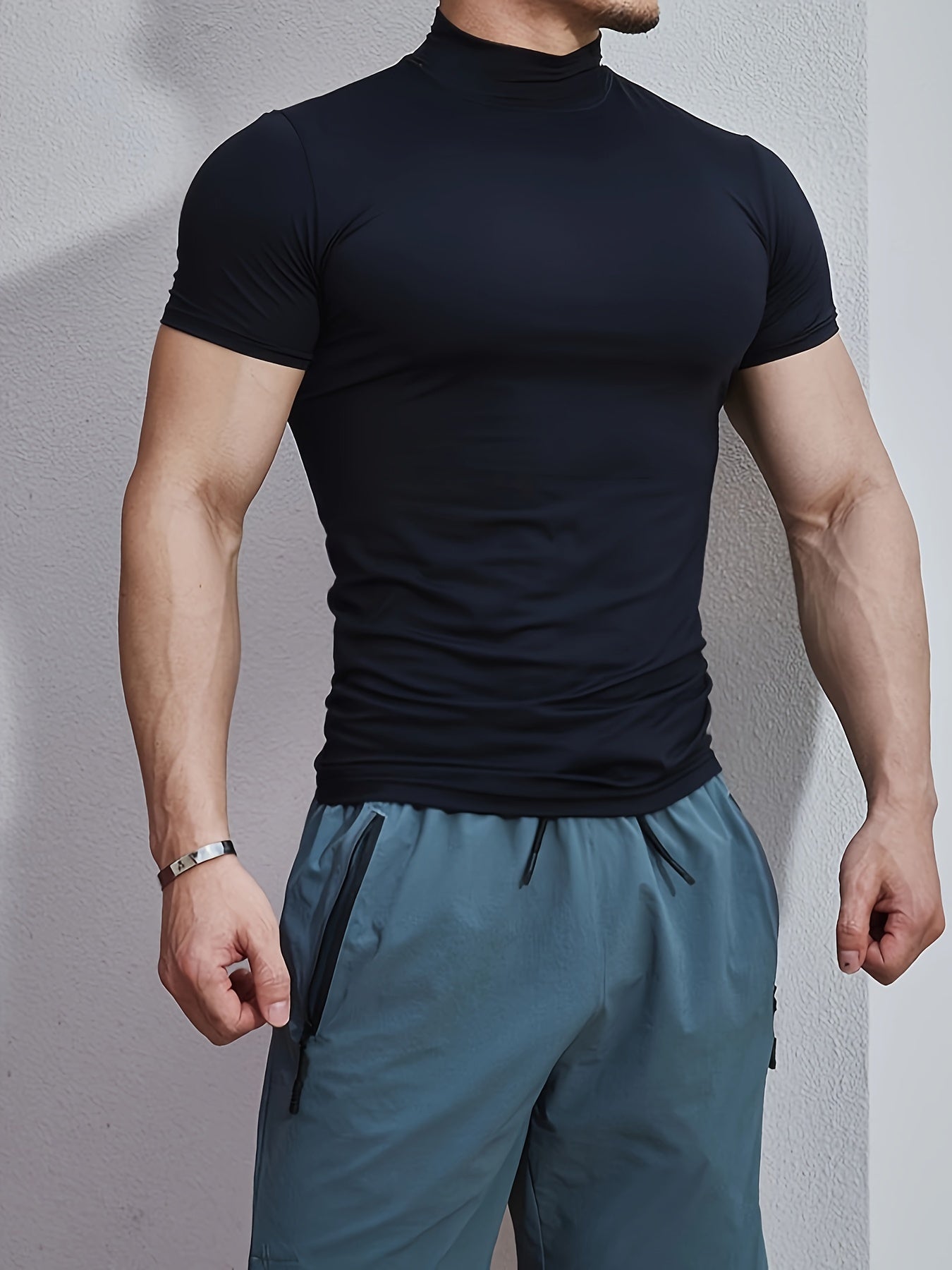 Men's athletic high neck t-shirt with quick dry, compression, and stretch fabric, ideal for training and running.