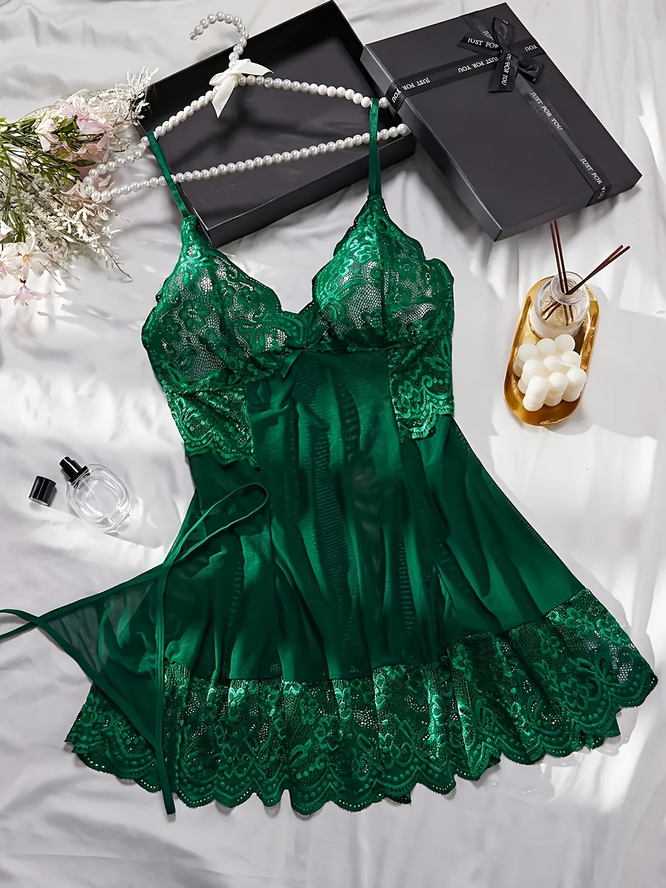 Plus size green lace lingerie set with fan decorations, includes babydoll and thong underwear. Made of 95% polyester and 5% spandex with bow detail.