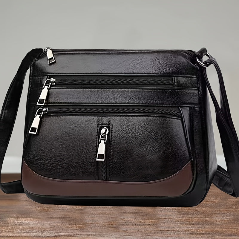 New crossbody shoulder bag with multiple layers and random zipper direction.