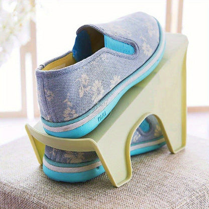 Plastic Shoe Storage Shelf with Two Tiers for Neatly Organizing Footwear in Your Closet.