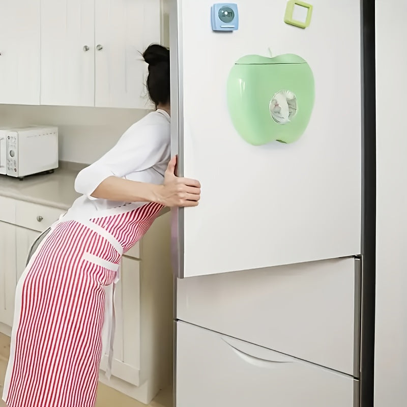 Apple-shaped wall-mounted storage organizer for plastic wrap and food covers. Unique closure, non-waterproof.