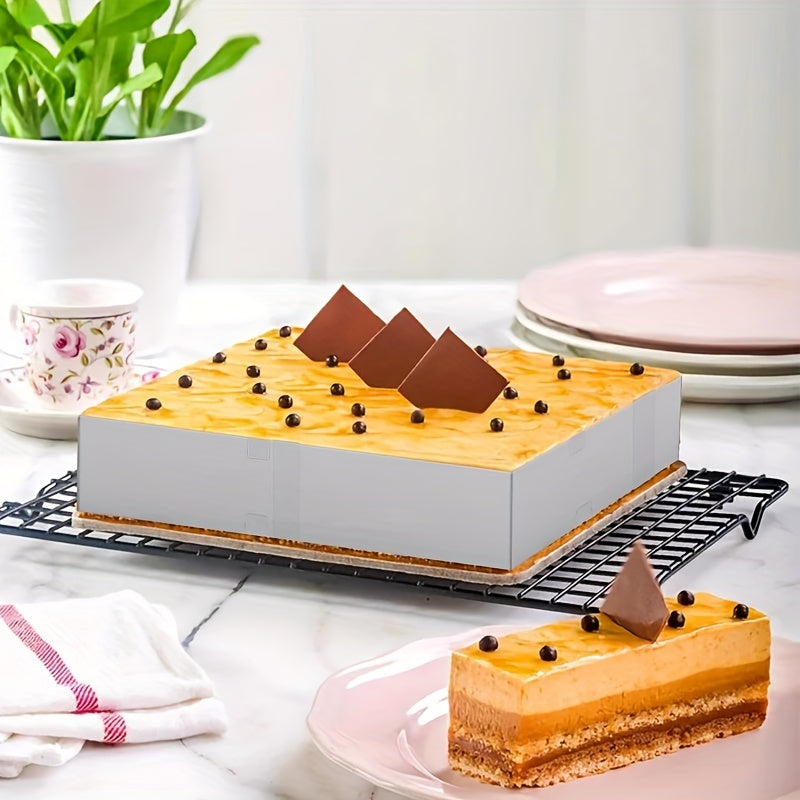 Adjustable, scalable stainless steel rectangular mousse cake mold, suitable for baking birthday cakes, tiramisu, bread, and pastries. Measures 27.94cm to 53.34cm. Perfect for all your baking needs.