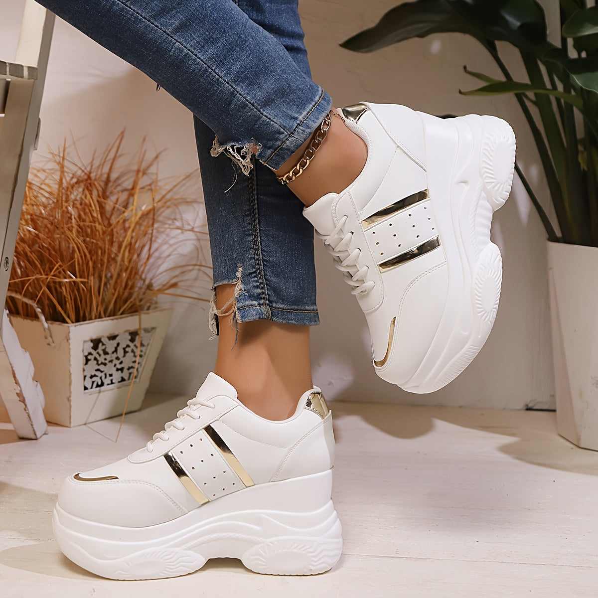 Gold-trimmed lace-up height-increasing casual sports shoes for women.