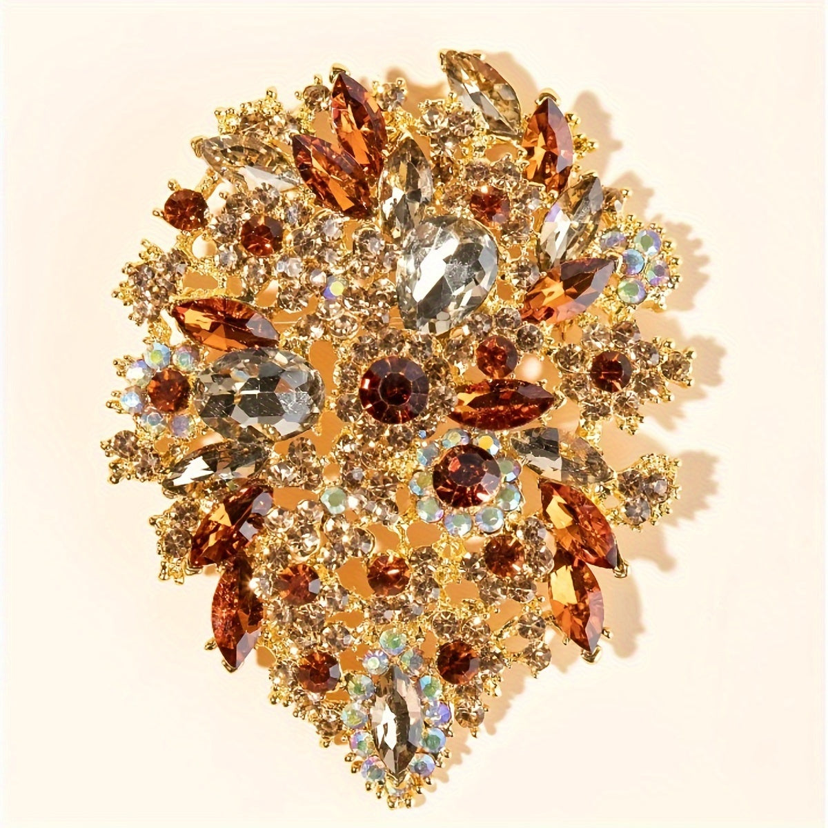 Trsince Brand offers an elegant and luxurious rhinestone brooch pin featuring an irregular shape and gold plated sparkly gemstones, perfect for any woman looking for a unique and stylish accessory.