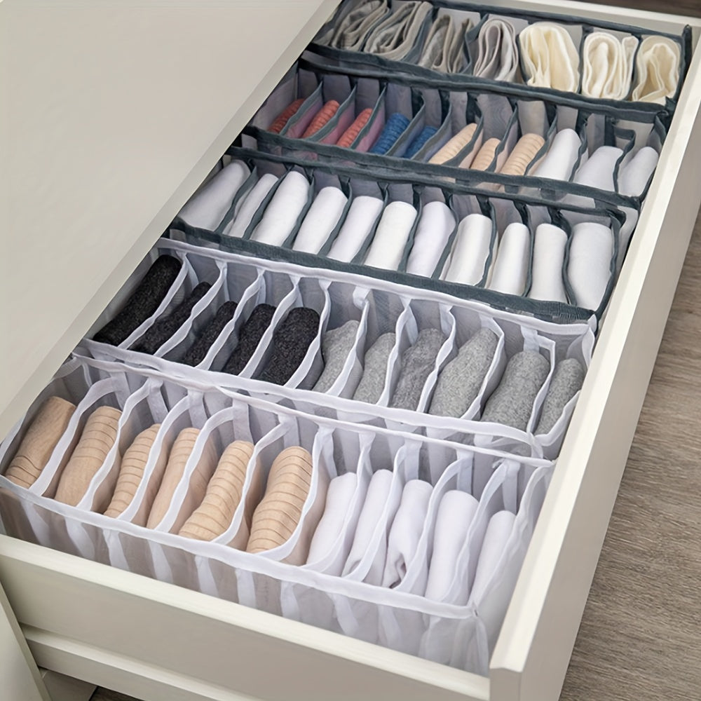 Fabric organizer boxes for underwear and socks in drawers.