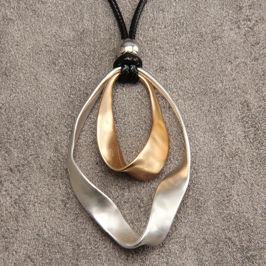 Stylish Twisted Teardrop Pendant Necklace for Women, made with Alloy featuring a Wide Edge Design. Includes a Simple Black Cord Long Chain, Perfect Romantic Gift for your Girlfriend. A Statement Jewelry Piece.