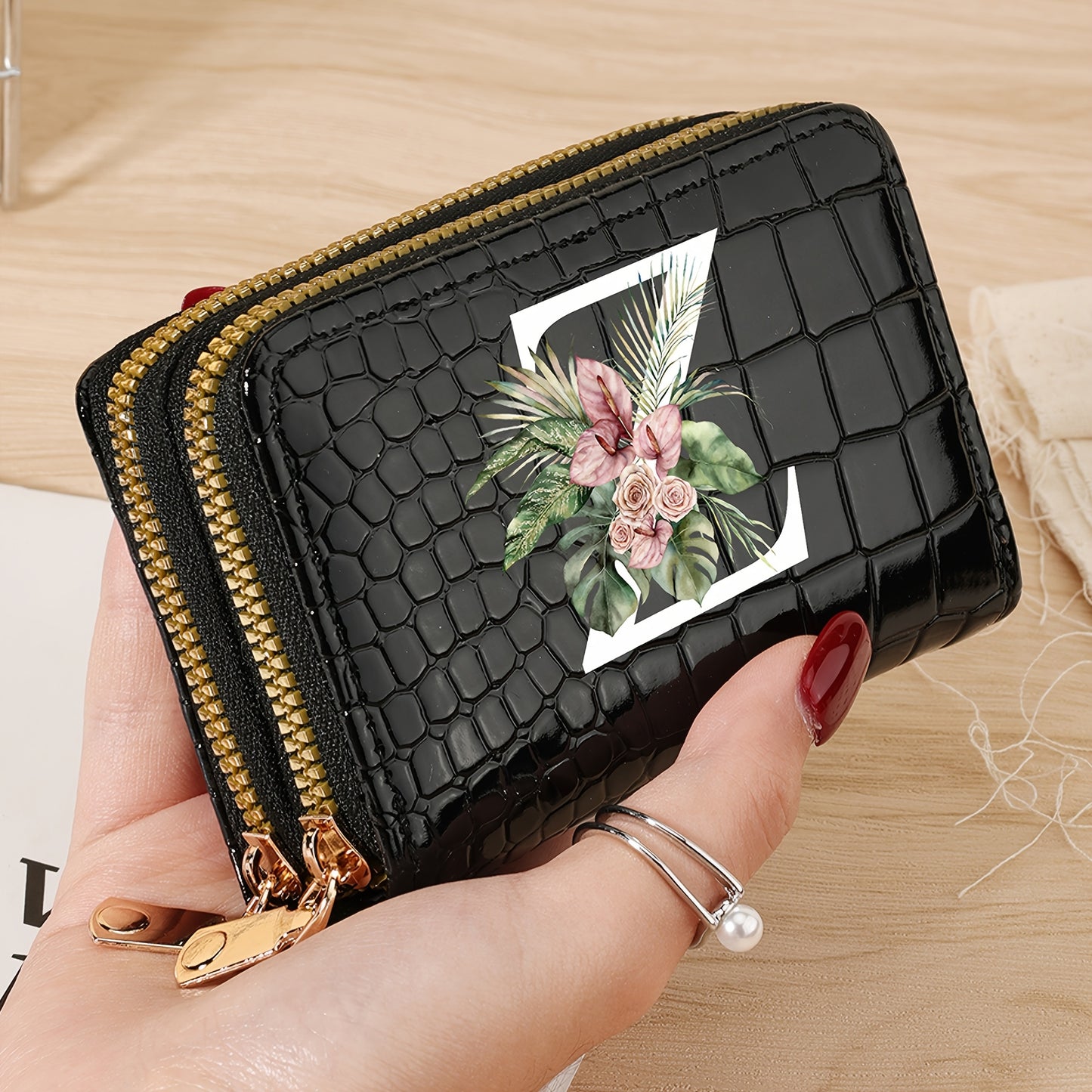 Women's credit card wallet with elegant floral letter print in black & white. Features large capacity, dual zipper, crocodile texture PU, lightweight design with nylon lining for everyday