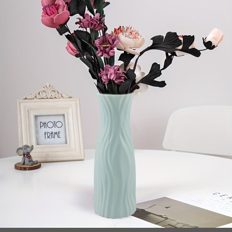 Plastic vase with ceramic look for home or office decor.