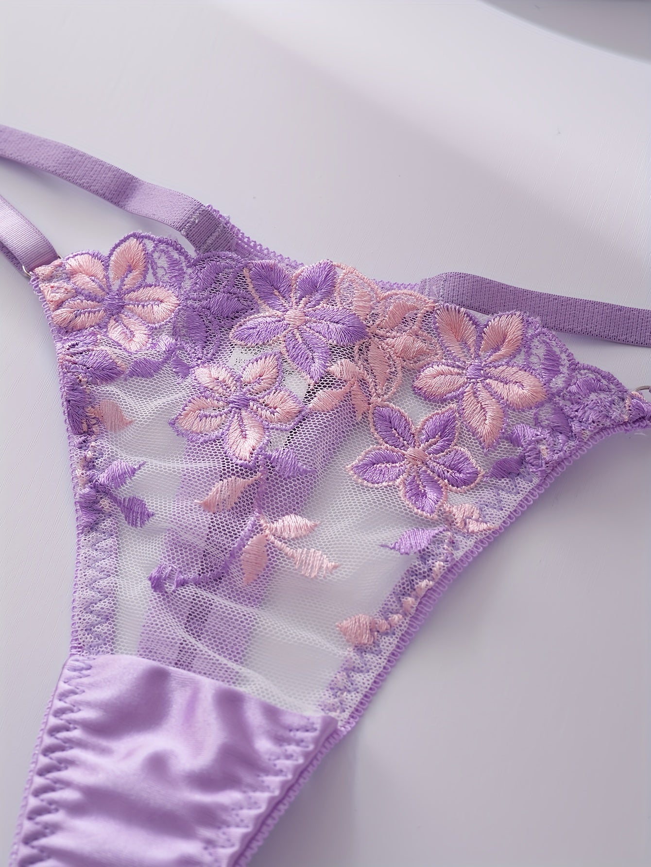 Floral embroidered lingerie set for women, featuring a sexy floral pattern, made from a blend of polyester and elastane. The set includes a medium support bra with underwire and no padding