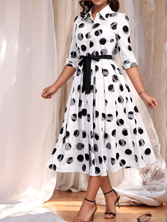 Vintage-inspired midi shirt dress with belt, polka dot print, collared design, and flared skirt in machine washable polyester.