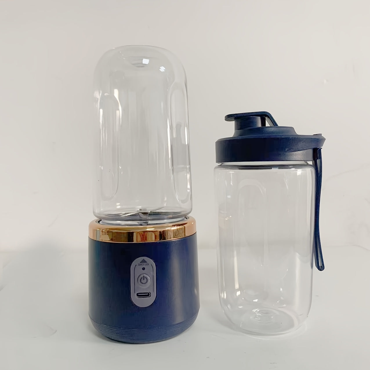 This portable blender is a personal smoothie maker with a travel lid, 2 cups each holding 13.53 ounces. It is a USB rechargeable mini fruit blender with 6 blades, making it suitable for use in the kitchen, at home, and while traveling.