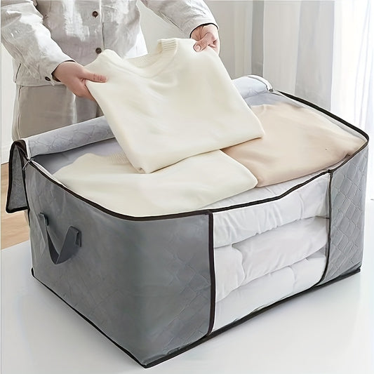 Big fabric bag with clear window for storing clothes and blankets.