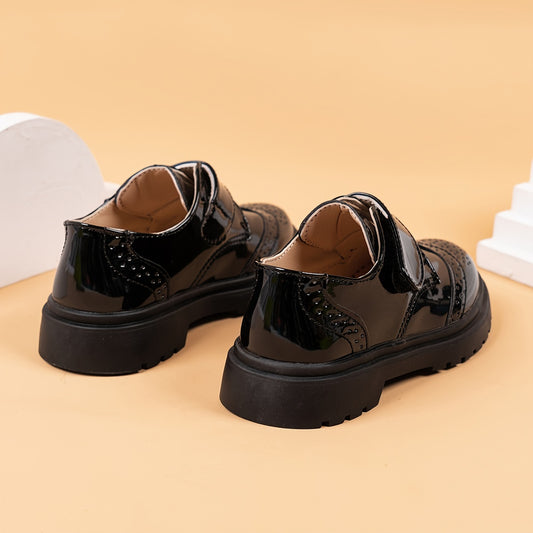 Breathable loafers for boys in shiny black PU with hook-and-loop closure, suitable for weddings, parties, and casual wear. Lightweight and comfortable for all seasons.