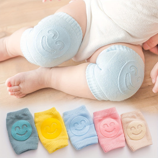 Two pairs of knee pads for toddlers to use while crawling, made from non-slip, phthalate-free polyester material. These elbow and knee protectors are designed for children aged 0-3 years old, providing safety for early walkers with a cheerful happy face