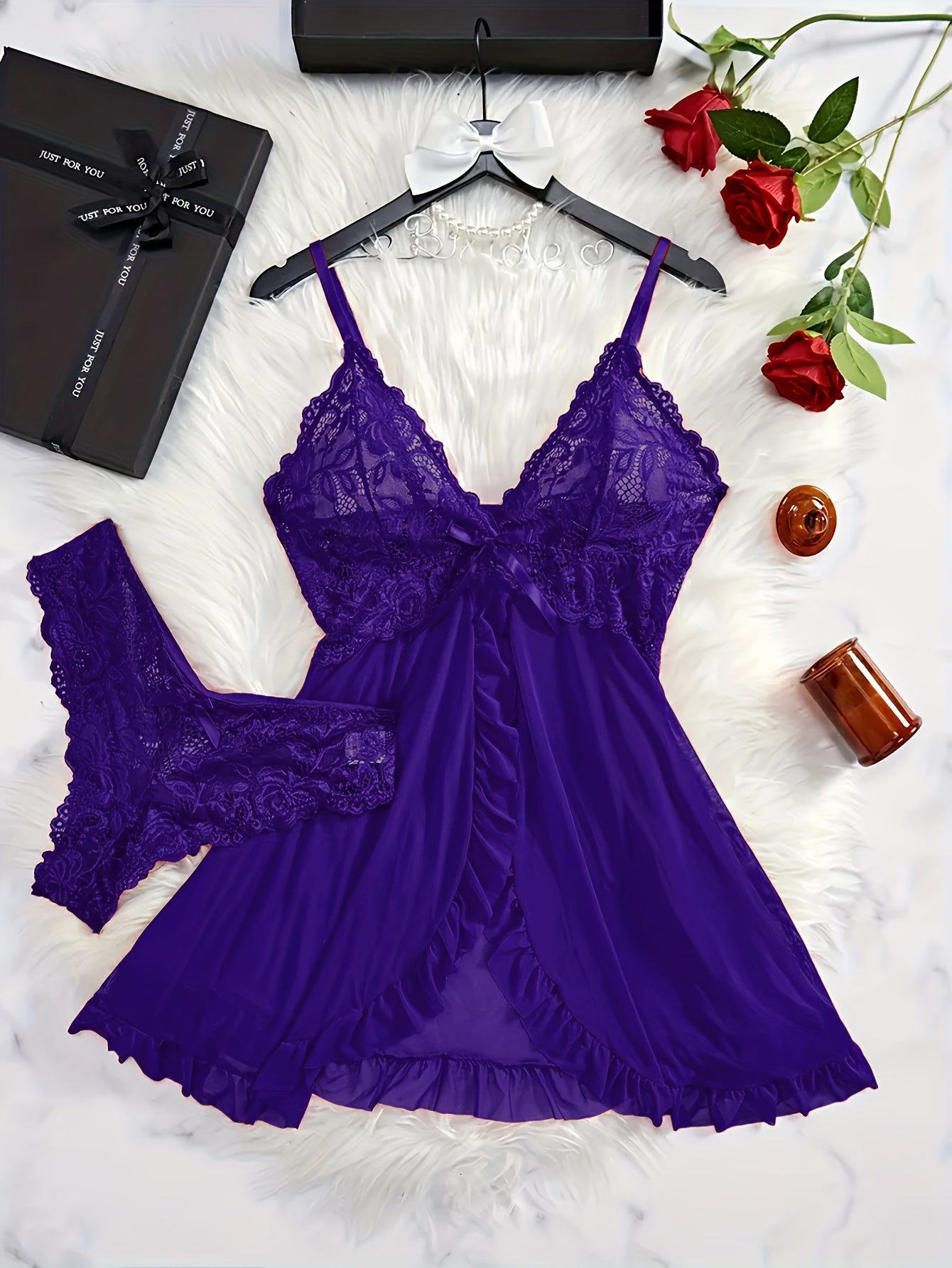 Sexy lace lingerie set for women includes polyester deep V-neck babydoll with ruffle hem, sheer bow-knot shorts, and G-string. Perfect for exotic sleepwear and undergarments.