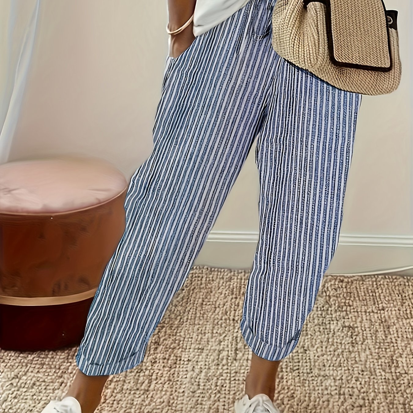 High-waisted, striped wide-leg pants for women made of lightweight polyester. Machine washable with side stripe detail for all-season comfort.