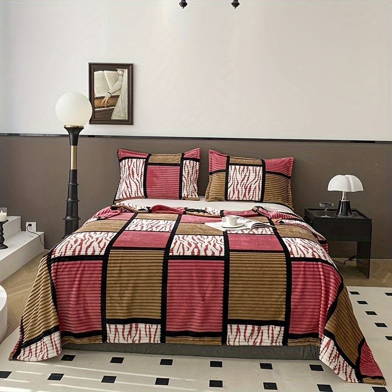 A plaid-patterned blanket that serves multiple functions in the home, including as a sofa throw.