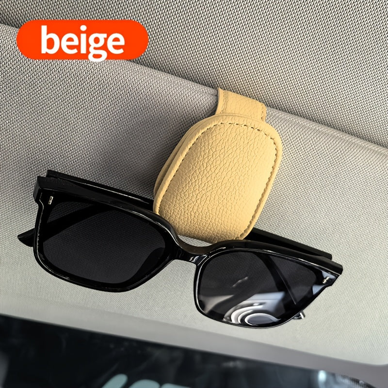 Universal car sun visor clip made of PVC material for storing eyeglasses in the vehicle interior.