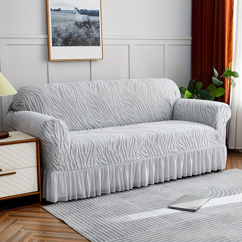 Wave pattern sofa slipcover with skirt, non-slip and dustproof. Protects furniture from cat scratches. Machine washable for easy cleaning. Suitable for bedroom, office, or living room décor.