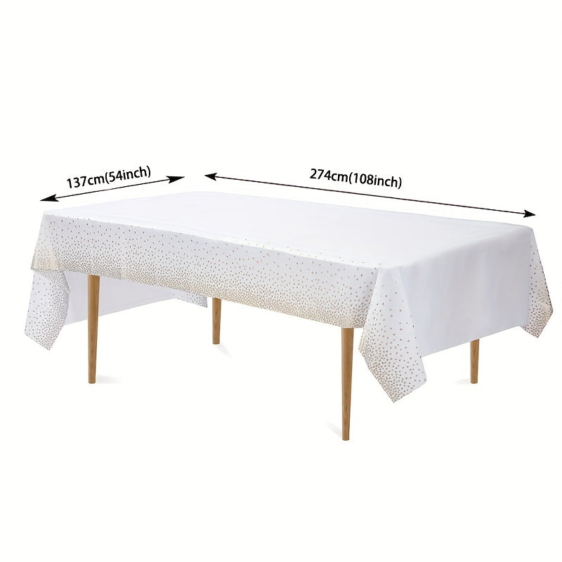 Disposable golden dot waterproof tablecloth, 137x274cm, for parties and events.