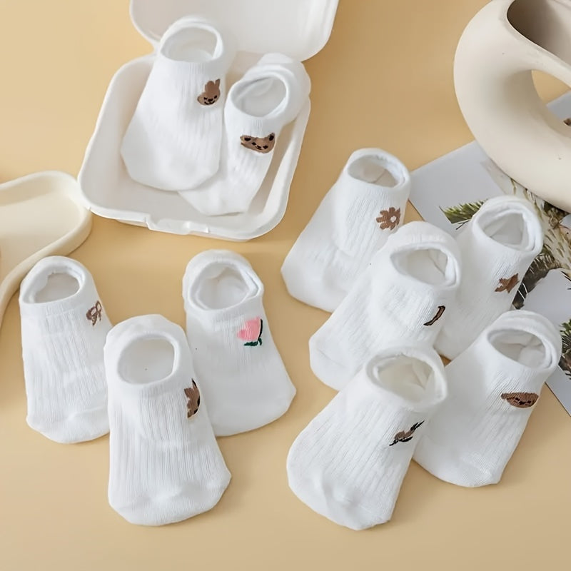 10 pairs of adorable white ankle socks with embroidered patterns, perfect for everyday wear.