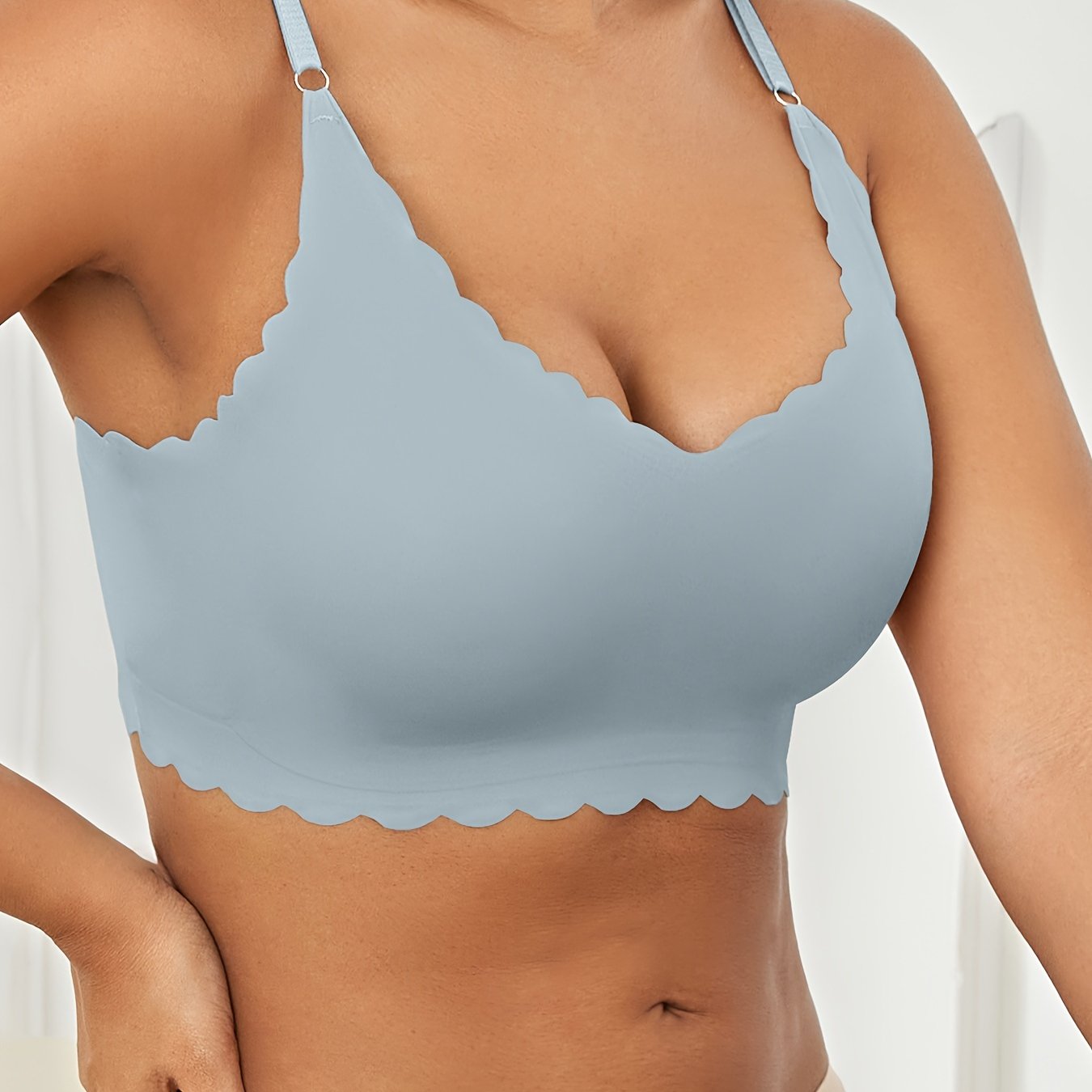 Seamless wireless bra for plus-size women with high elasticity and removable padding, in v-neck solid color.