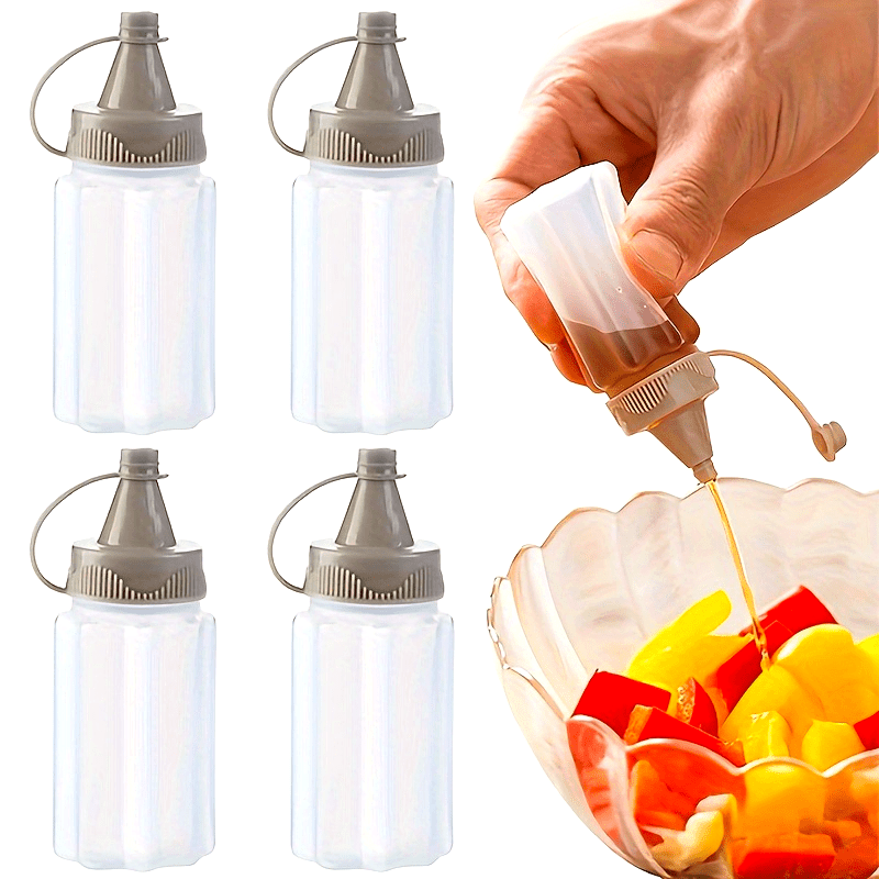 Set of 4 mini transparent seasoning bottles with gray lids, made of food-grade plastic for sauces and dressings. Portable and reusable squeeze containers for BBQs and kitchen use, hand-wash only.