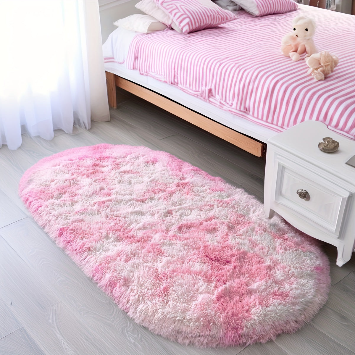 Soft and fluffy oval shaggy area rug, perfect for bedroom or living room. Made with skin-friendly thickened sponge and tufted polyester material. Durable and easy to maintain. Adds decorative touch to indoor spaces such as sofa, bedside, playroom, or