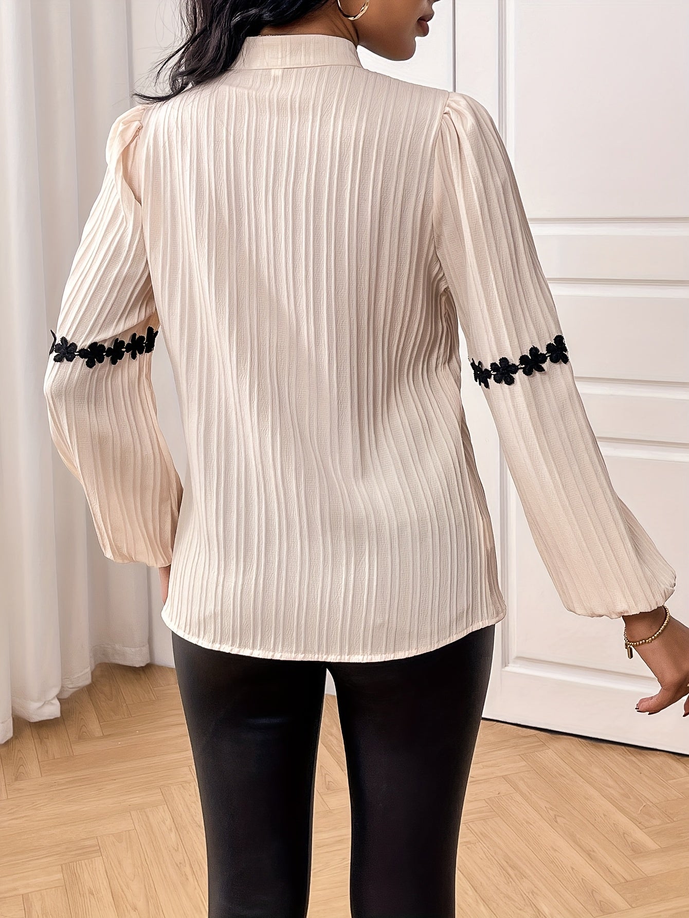 Stylish lace-trimmed blouse with textured wave stripe, stand collar, and lantern sleeves - ideal for fall and winter.