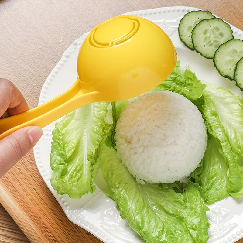 Large yellow plastic rice ball mold with easy-release feature, non-stick half-sphere design, and built-in strainer for kids' meals.