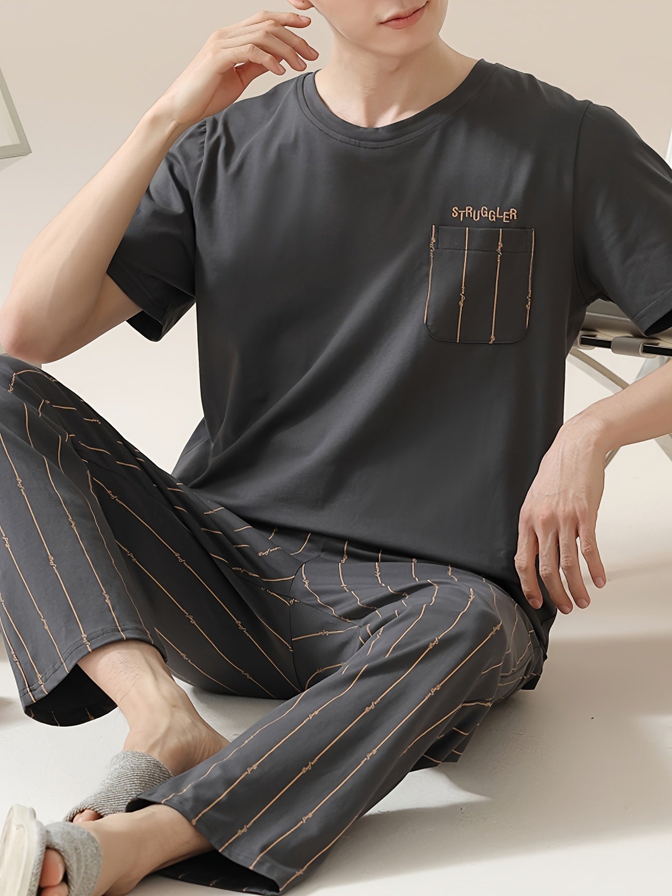 Men's 2-piece simple pocket round neck short sleeve pajama set with striped trousers. Comfortable and skin-friendly for cozy loungewear.