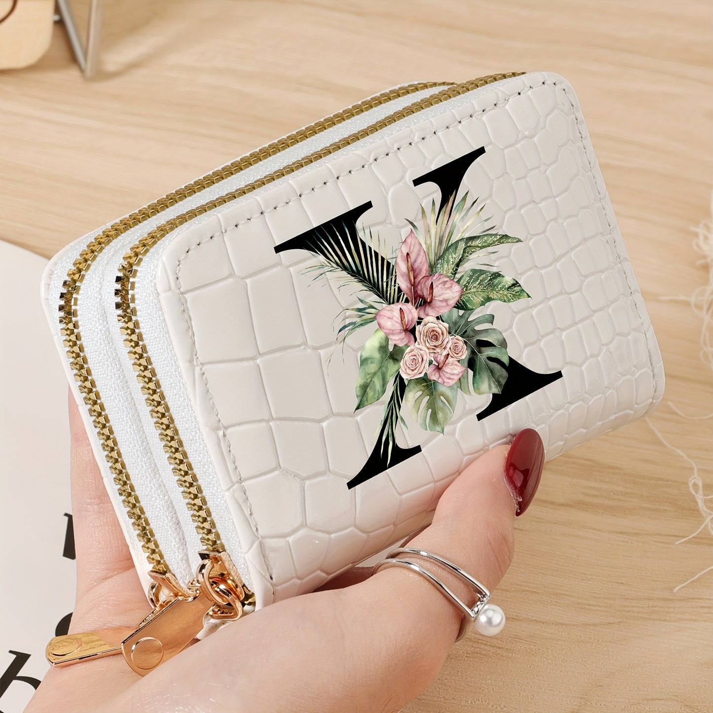 Women's credit card wallet with elegant floral letter print in black & white. Features large capacity, dual zipper, crocodile texture PU, lightweight design with nylon lining for everyday