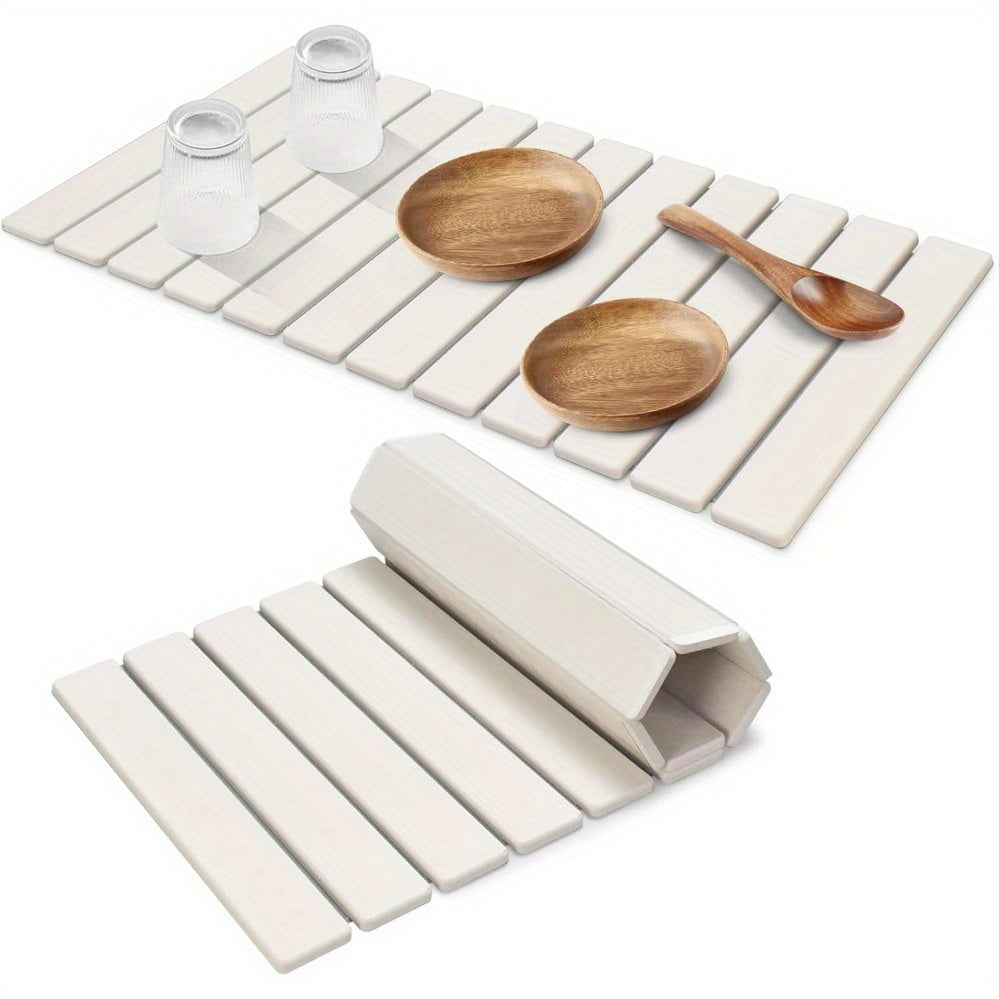 Get your hands on the 1pc Diatom Mud Dish Drying Mat, a collapsible and quick dry countertop pad measuring 60.96cm x 40.64cm. This large absorbent stone mat is perfect for drying dishes, bottles, and cups, and fits seamlessly on any kitchen counter.