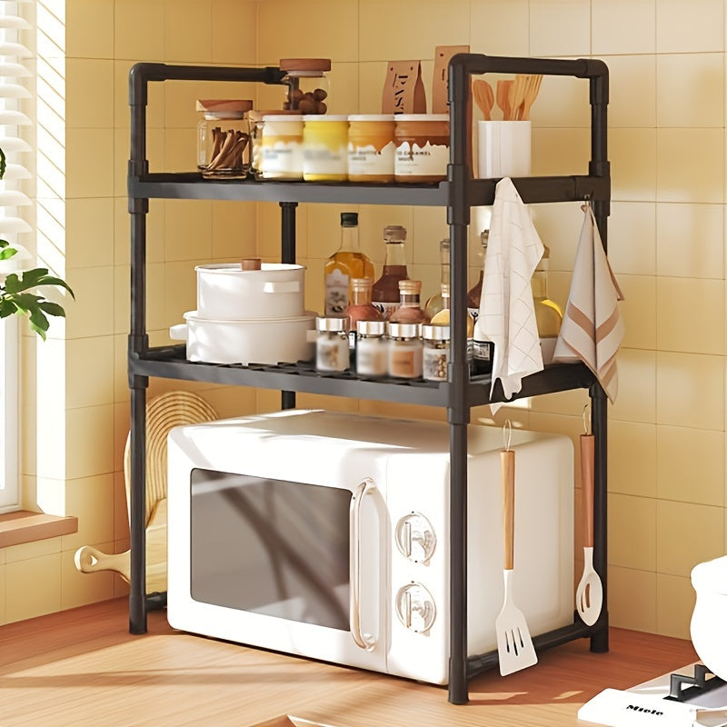 A modern kitchen storage shelf with stainless steel microwave stand and double layer, multi-layer oven rack organizer. Made with metal and plastic materials, this contemporary all-in-one piece is perfect for the dining room and requires no assembly.