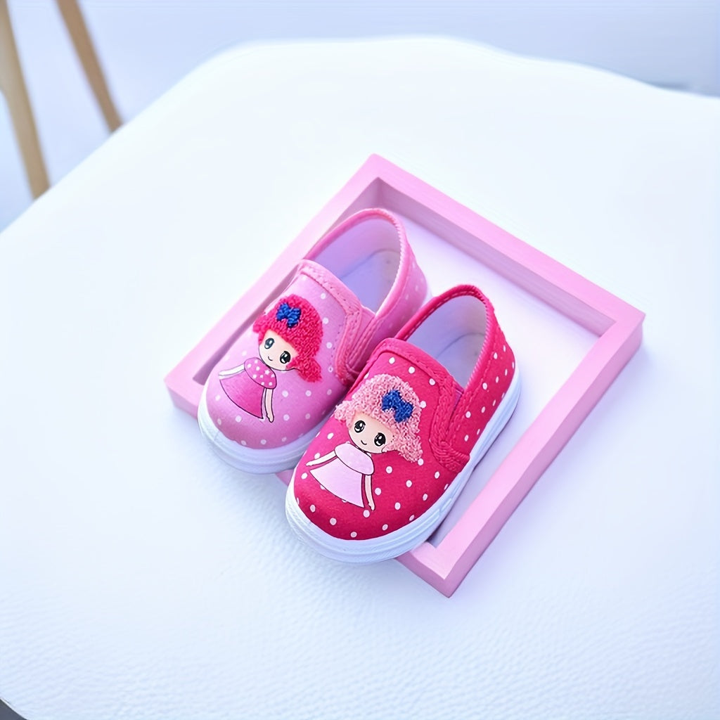 Adorable pink polka dot slip-on canvas shoes for girls featuring cute cartoon embroidery, breathable fabric, lightweight and comfortable for spring and fall. Durable TPR sole and easy