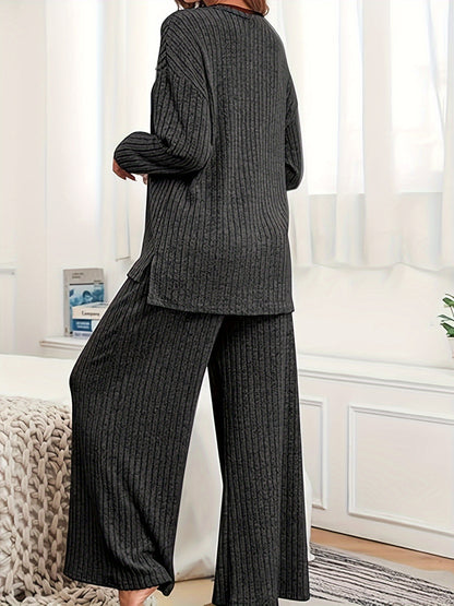 Women's casual suit with ribbed knit top and matching hooded wide-leg pants.