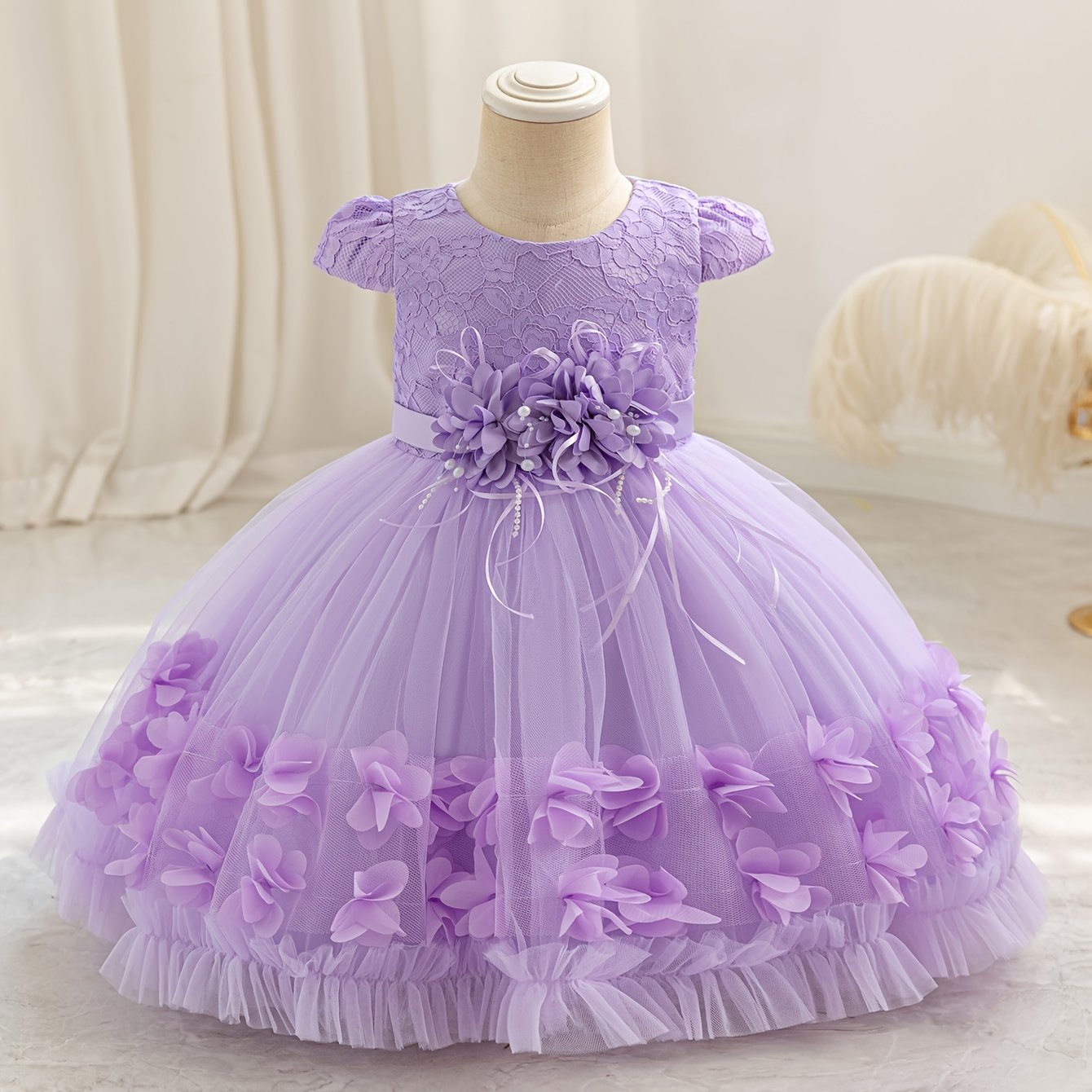 Baby's floral tulle princess dress with lace sleeves for formal occasions.