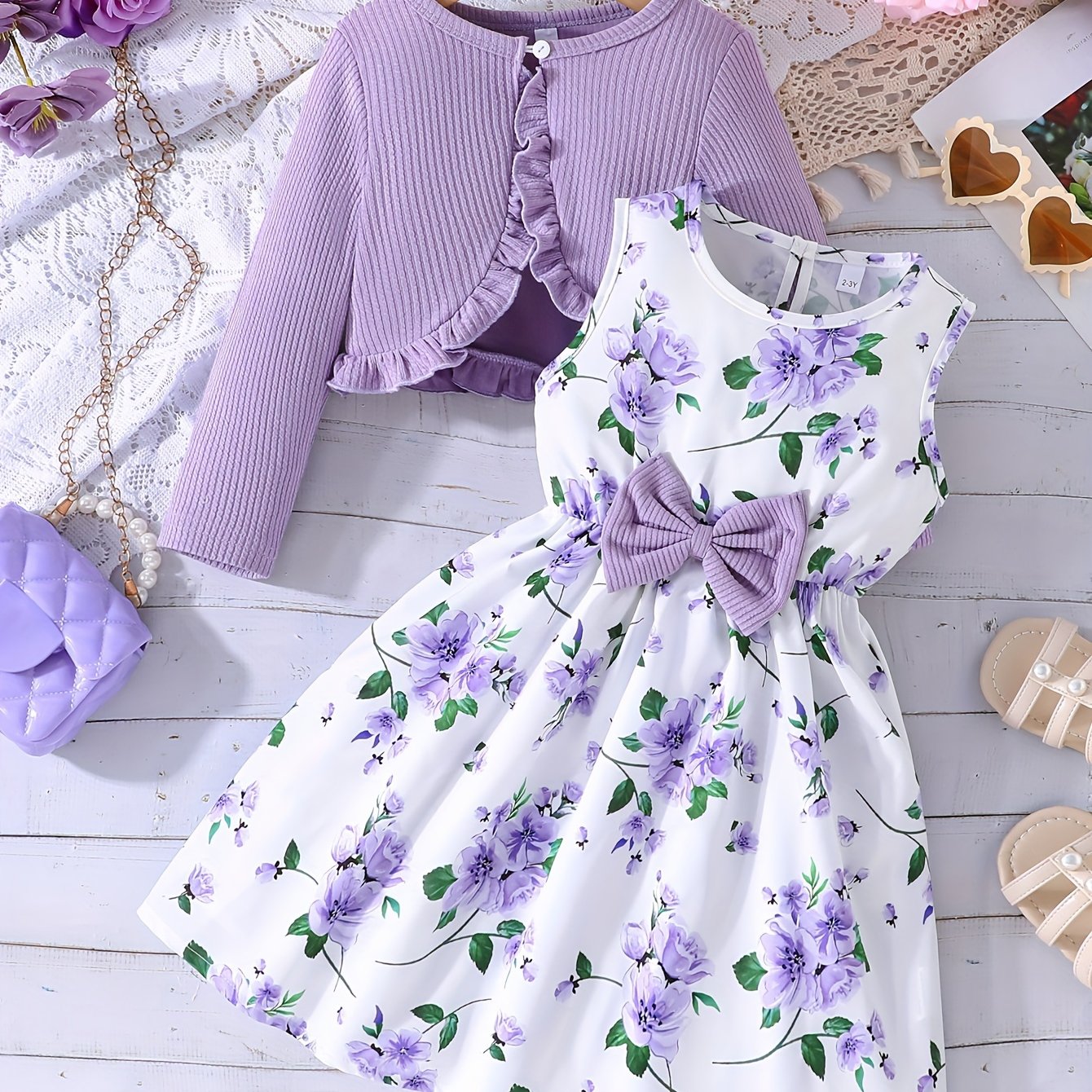 Flower print vest dress with chest measurement paired with a solid color long sleeve jacket for girls.