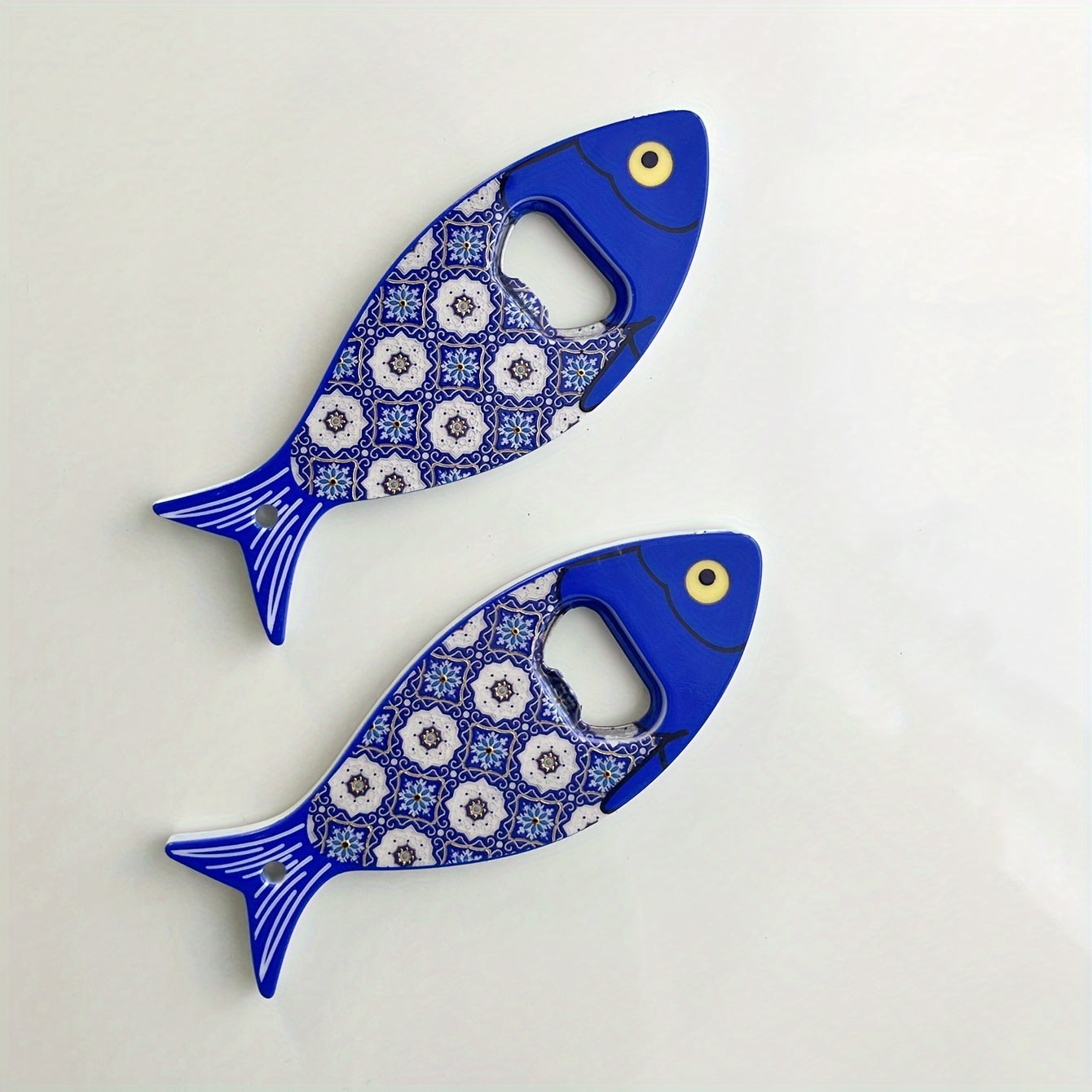 Fish-shaped cap opener with magnet for refrigerator decoration, no power required.