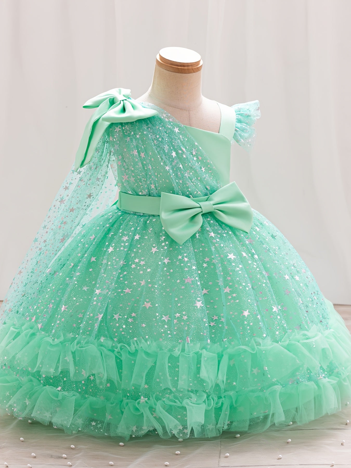 Princess dress for girls with one-shoulder ruffle sleeves, sparkling sequins, and a fluffy design, ideal for weddings, birthdays, and parties.