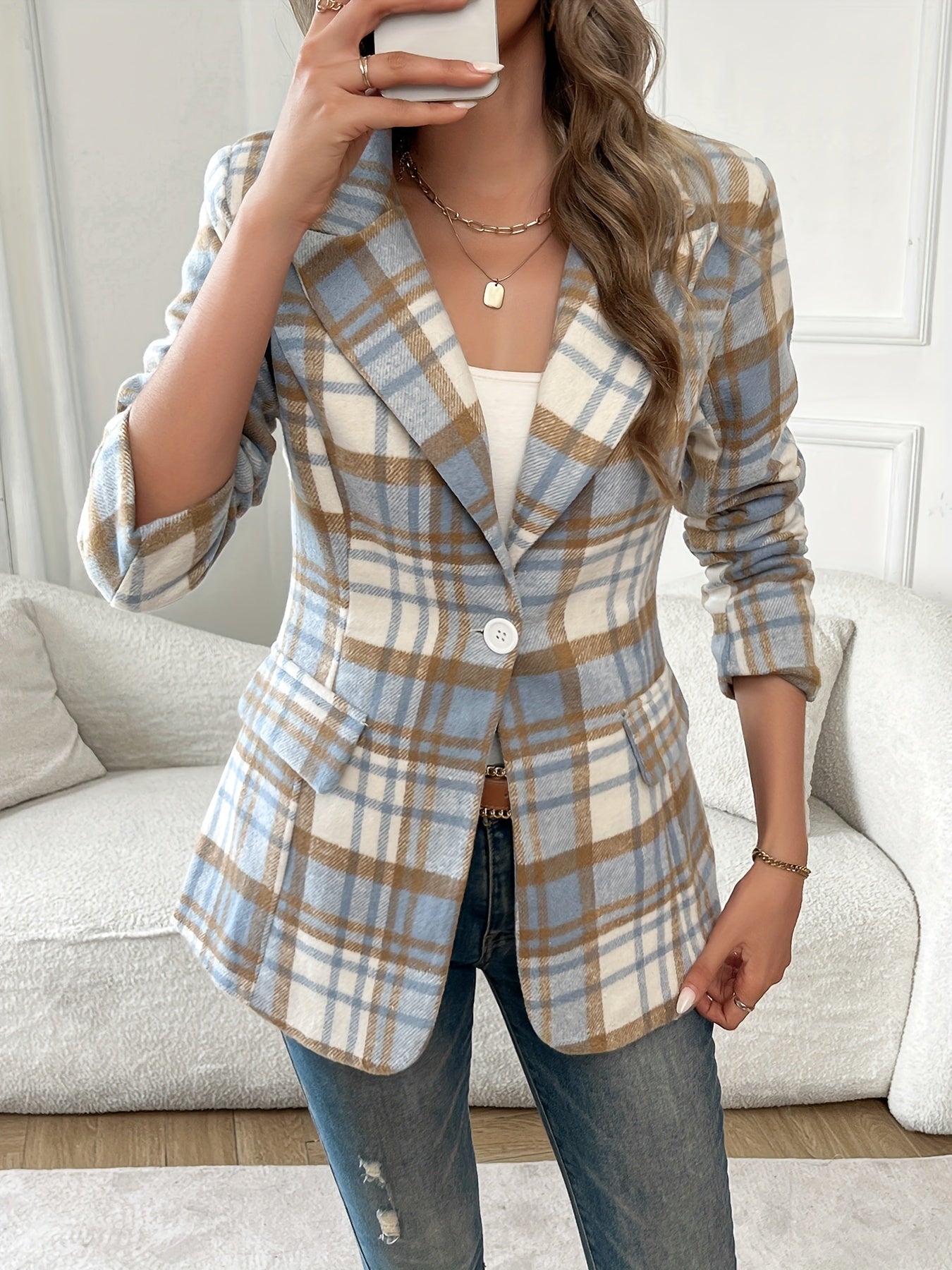 Classic plaid blazer with lapel and buttons, perfect for office and work attire.