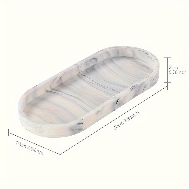 Silicone oval vanity tray with soap dispenser and sponge holder for bathroom décor.